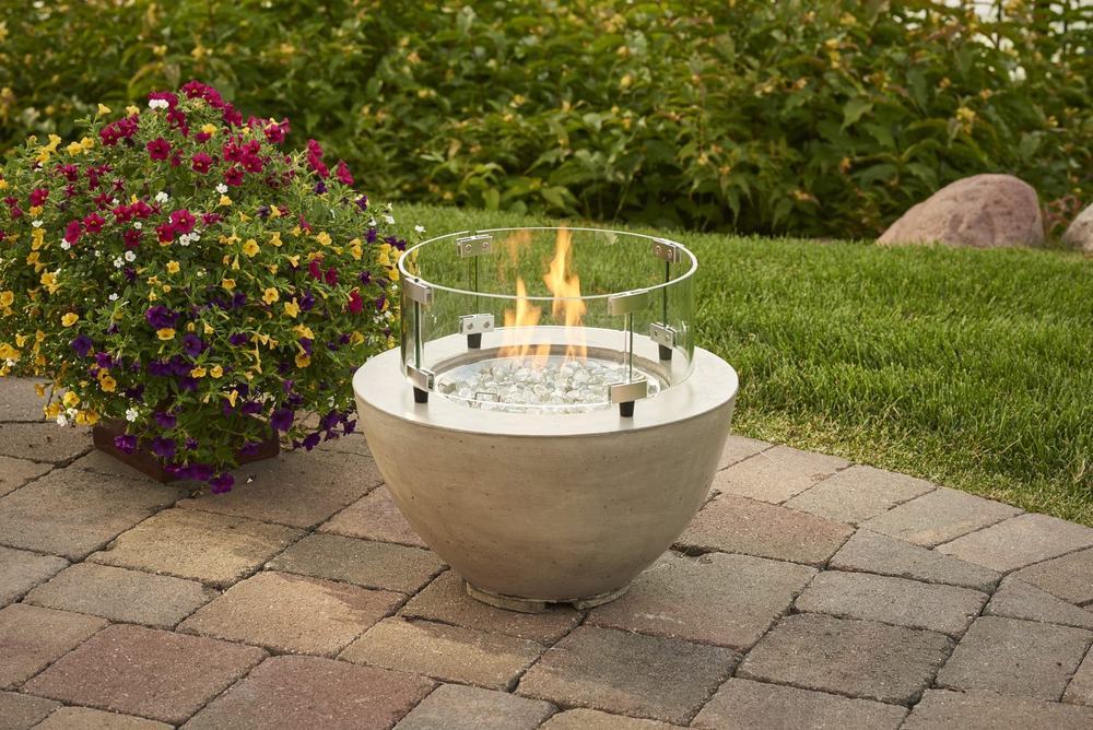 An outdoor fireplace and living space