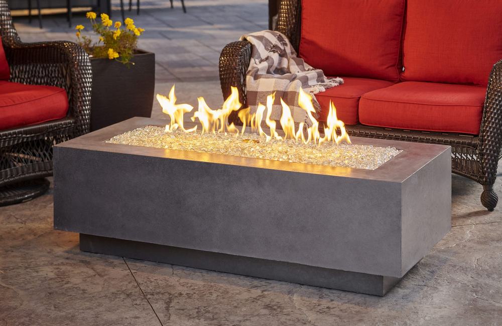 An outdoor fireplace and living space