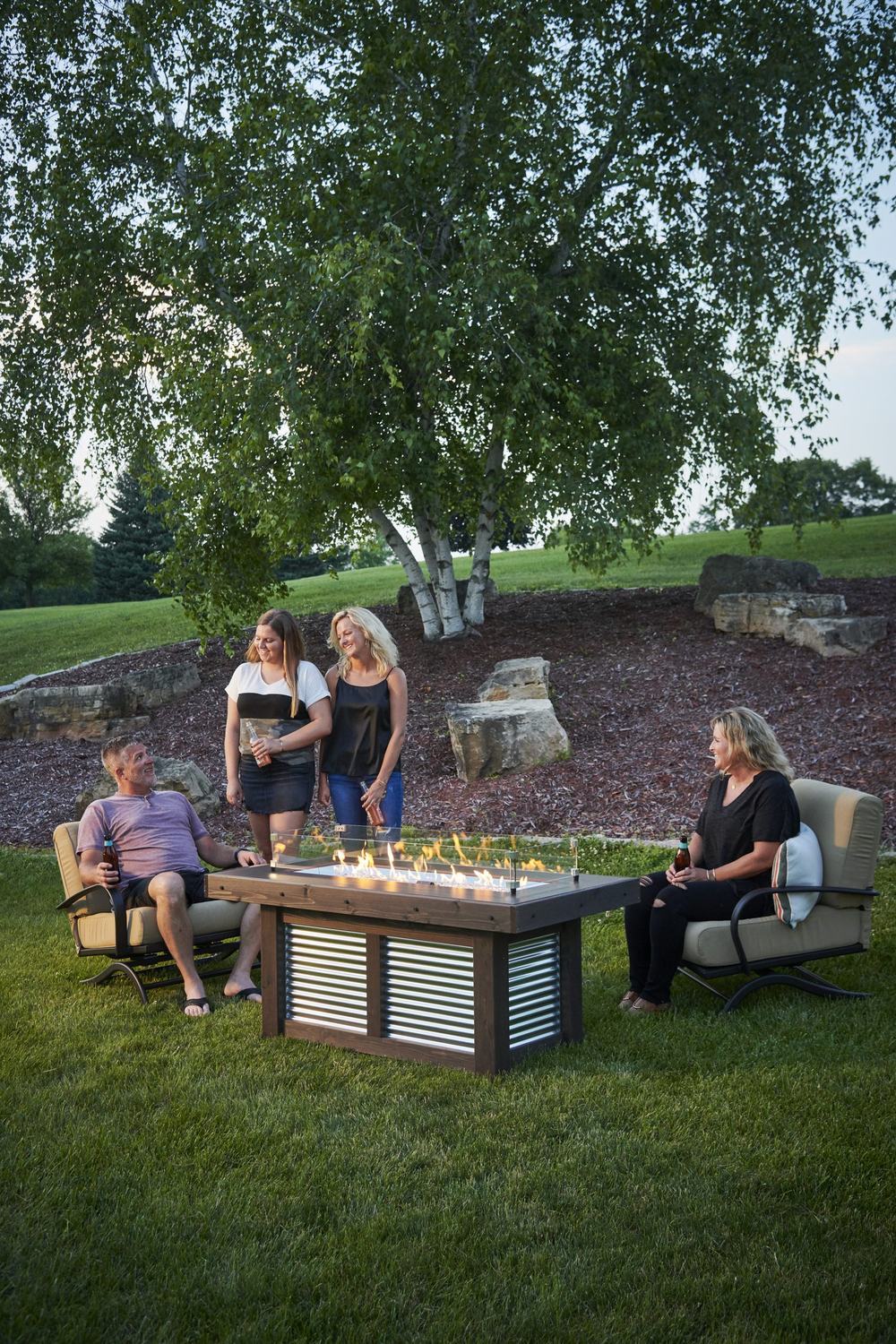 An outdoor fireplace and living space