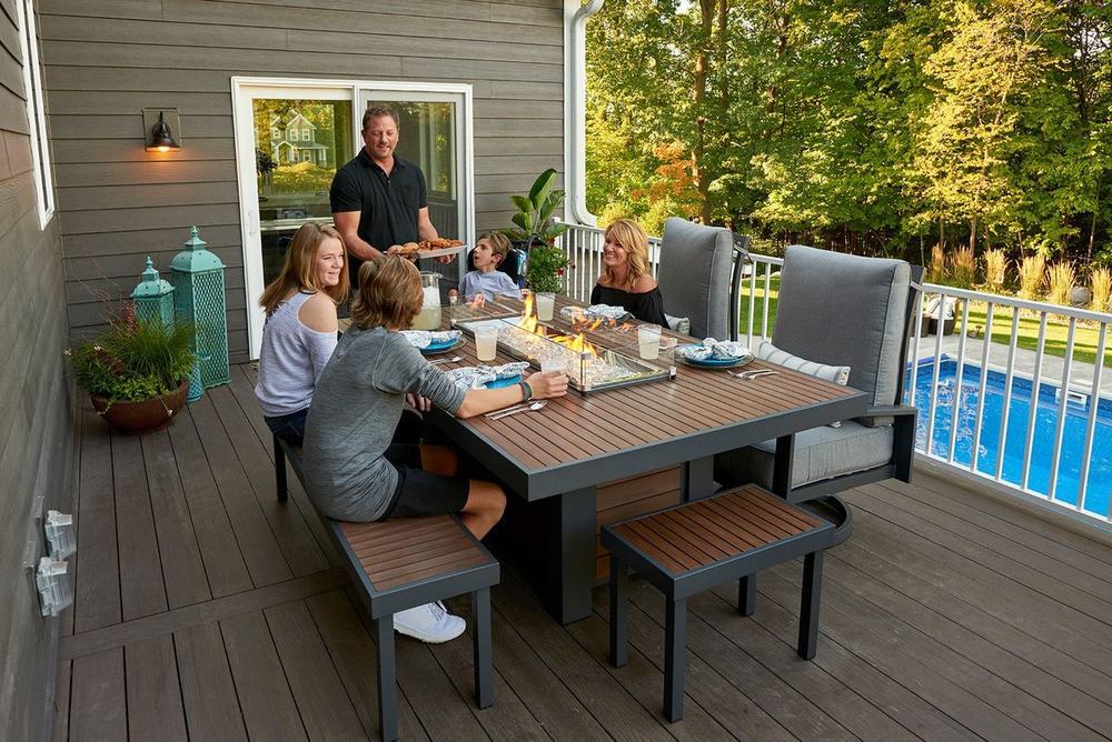 An outdoor fireplace and living space