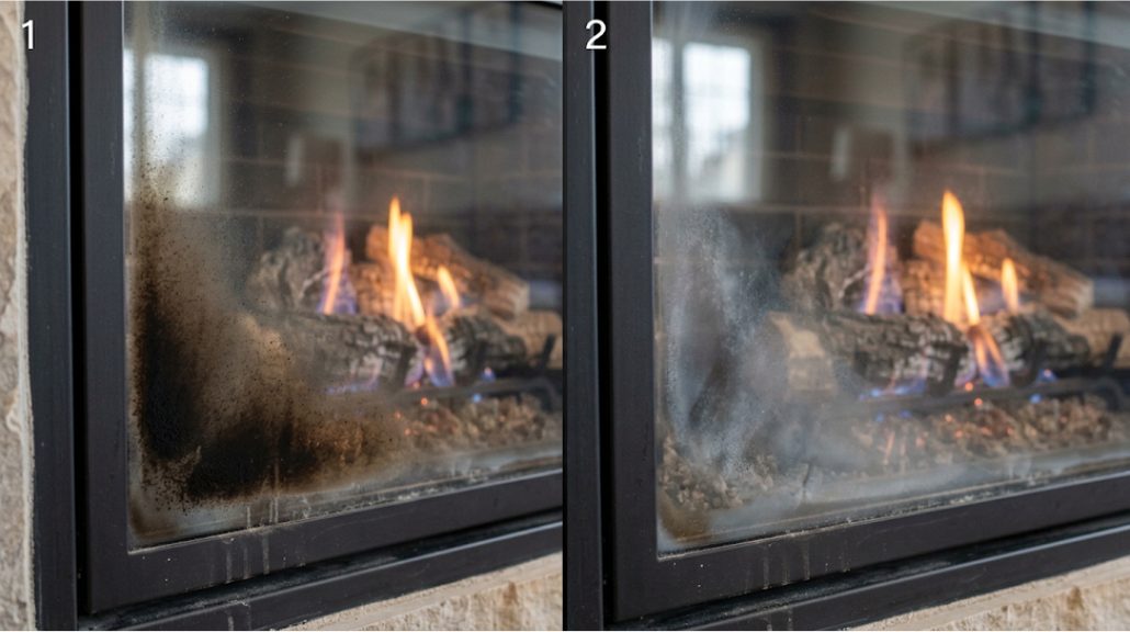 The same lit gas fireplace photographed twice side by side, numbered one and two: on the left the glass has a dark black soot coating spreading up from the lower left corner, and on the right the glass has a pale white cloudy haze in the same area