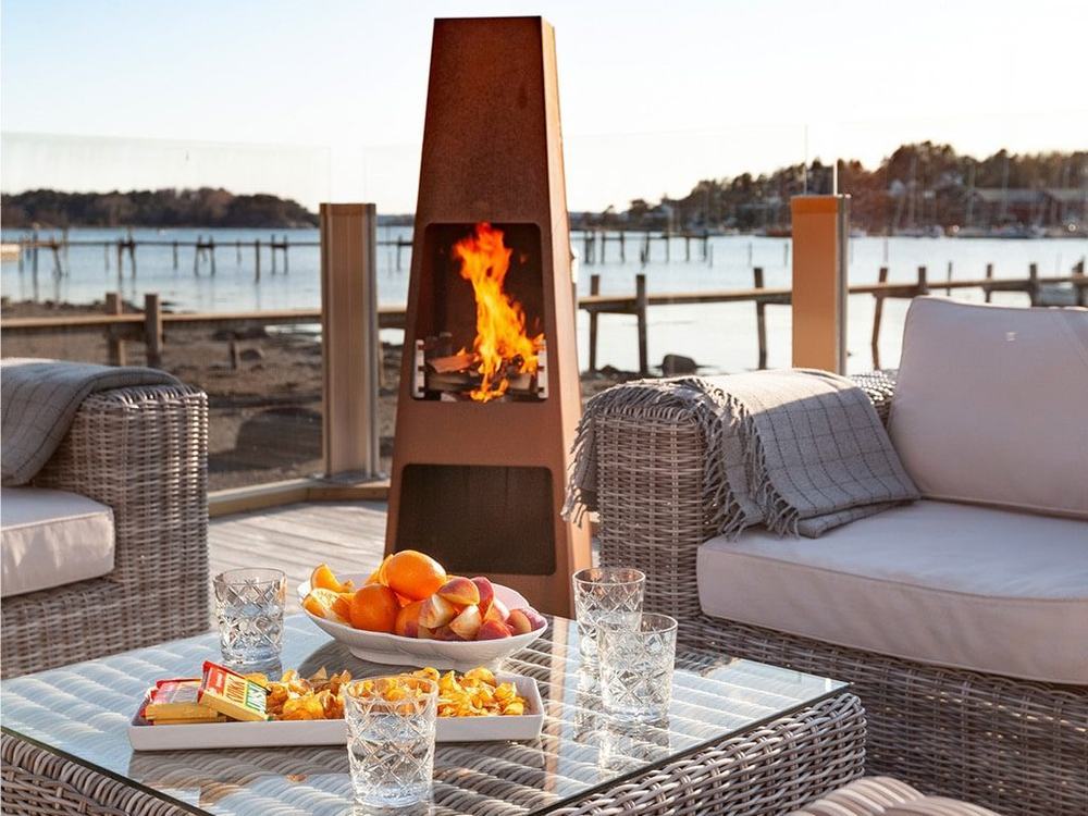 An outdoor fireplace and living space