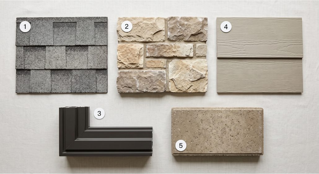 Five numbered exterior material samples laid out on a linen surface: a gray architectural roof shingle, a cream and buff stone veneer panel, a dark bronze window frame corner, a taupe woodgrain lap siding board, and a tan travertine paver