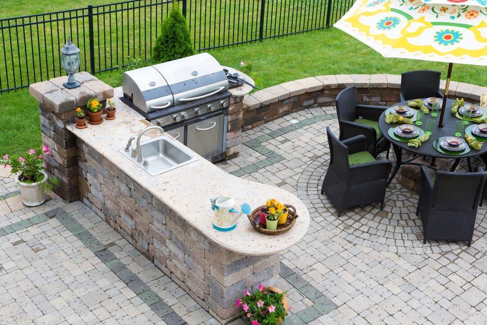 An outdoor fireplace and living space