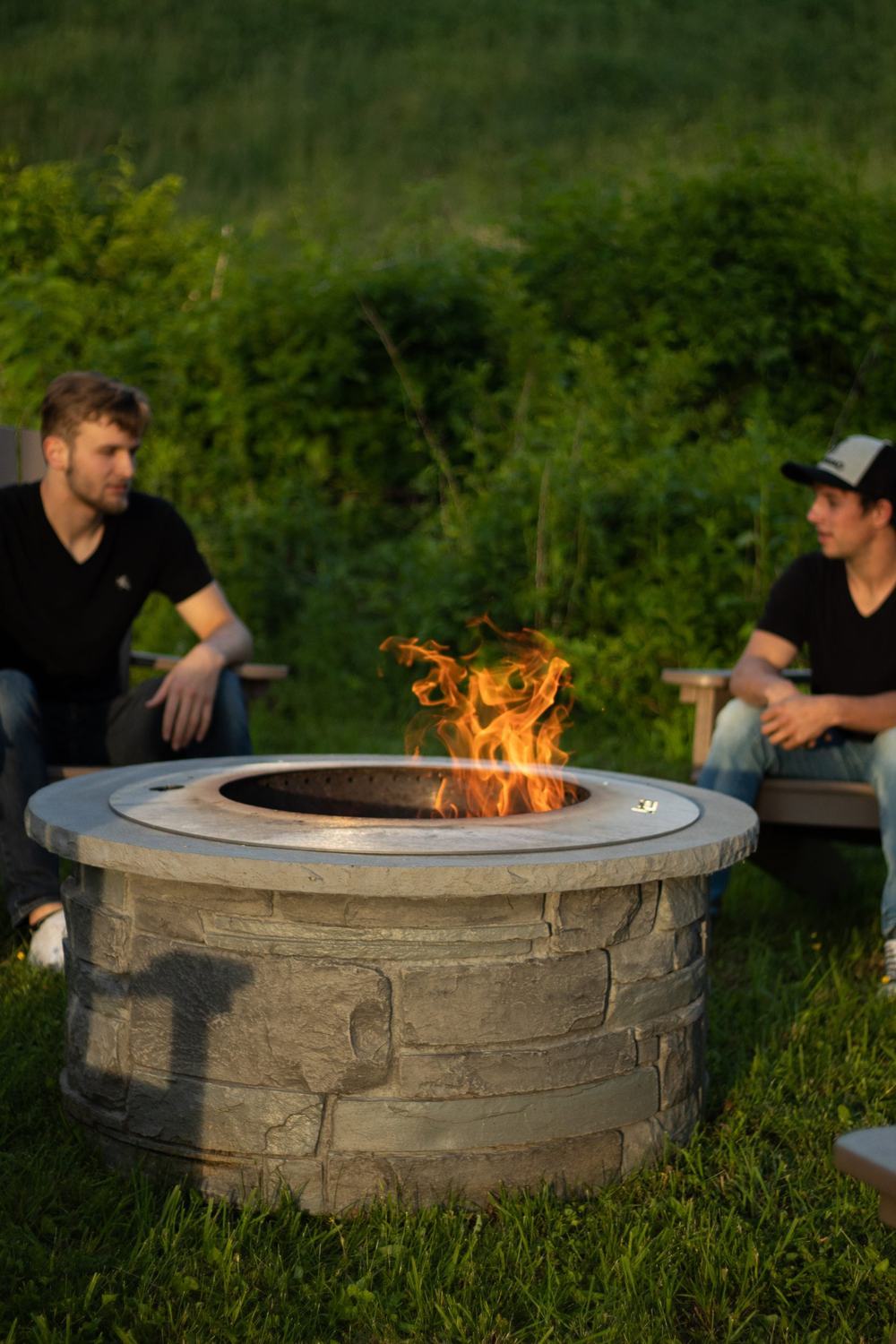 An outdoor fireplace and living space