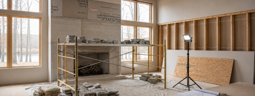 Builder preparing for fireplace installation in a West Michigan home project